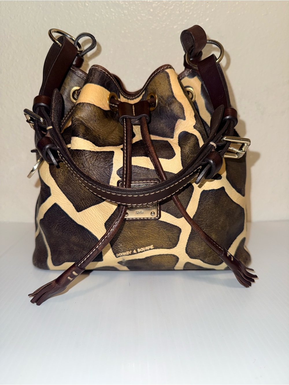 Dooney & Bourke Brown and Cream Giraffe-Print Drawstring Bucket Bag